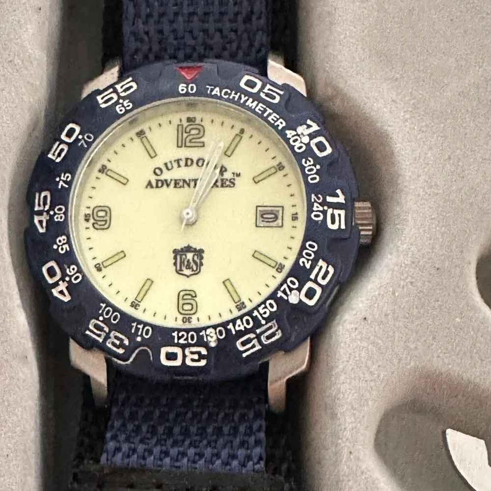 Field and Stream Outdoors men type of watch and utility tool set